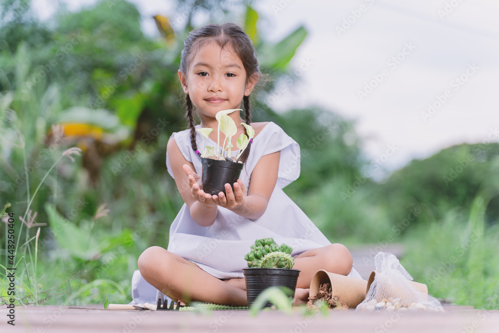 New Normal'A little girl planting trees. New Normal'A little girl planting trees.