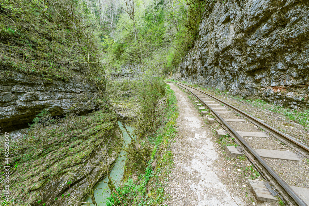 Narrow gauge railway in the deep narrow Guam canyon. Western Caucasus. Narrow gauge railway in the deep narrow Guam canyon. Western Caucasus.