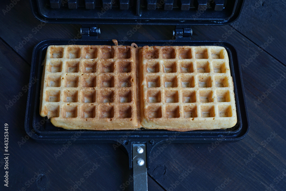 High angle of waffle in waffle maker mold High angle of waffle in waffle maker mold