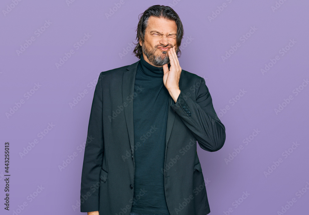 Middle age handsome man wearing business clothes touching mouth with hand with painful expression because of toothache or dental illness on teeth. dentist Middle age handsome man wearing business clothes touching mouth with hand with painful expression because of toothache or dental illness on teeth. dentist