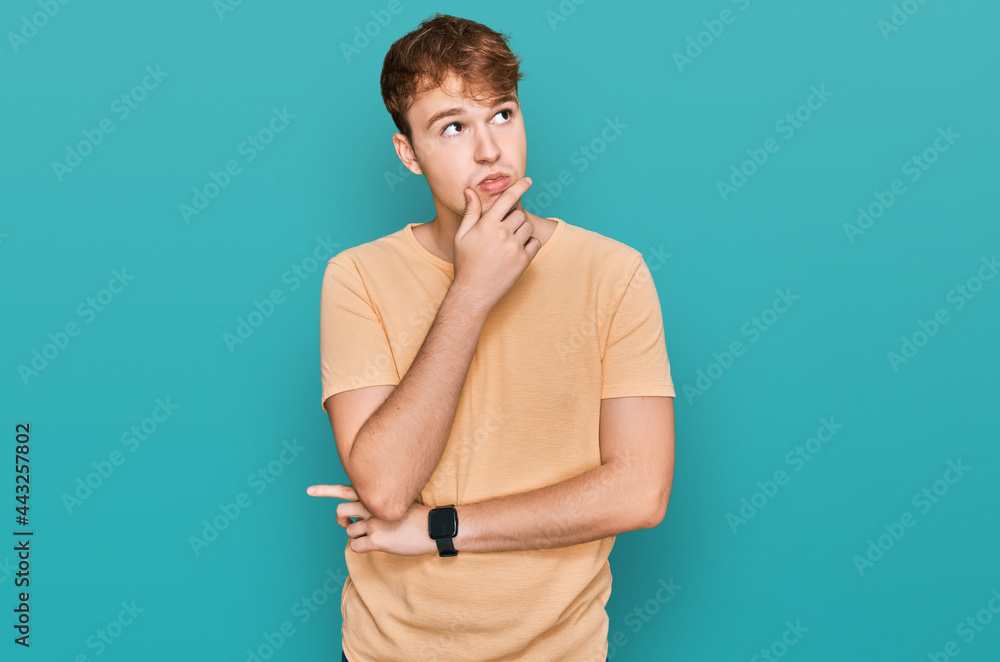Young caucasian man wearing casual clothes thinking worried about a question, concerned and nervous with hand on chin