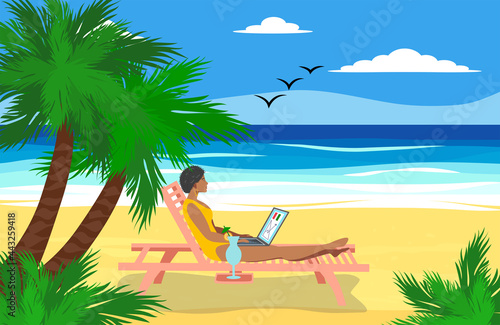 Woman lying in a deck chair with a laptop and having a tropical cocktail under the palm trees by the sea. Freelancer and palms, remote work concept
