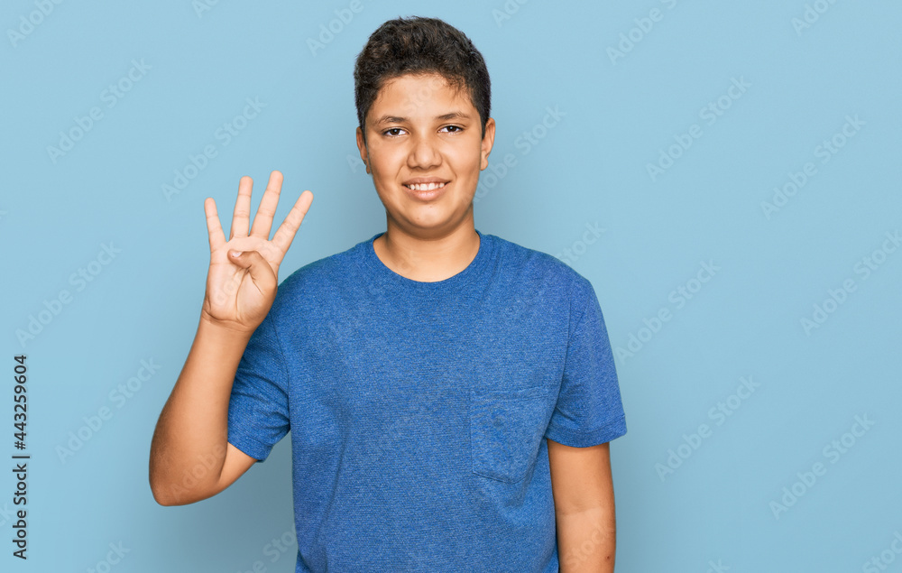 Teenager hispanic boy wearing casual clothes showing and pointing up with fingers number four while smiling confident and happy. Teenager hispanic boy wearing casual clothes showing and pointing up with fingers number four while smiling confident and happy.