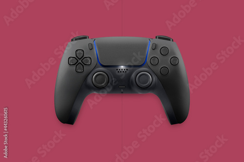 Next generation black game controller isolated on cosmic red background. Top view.
