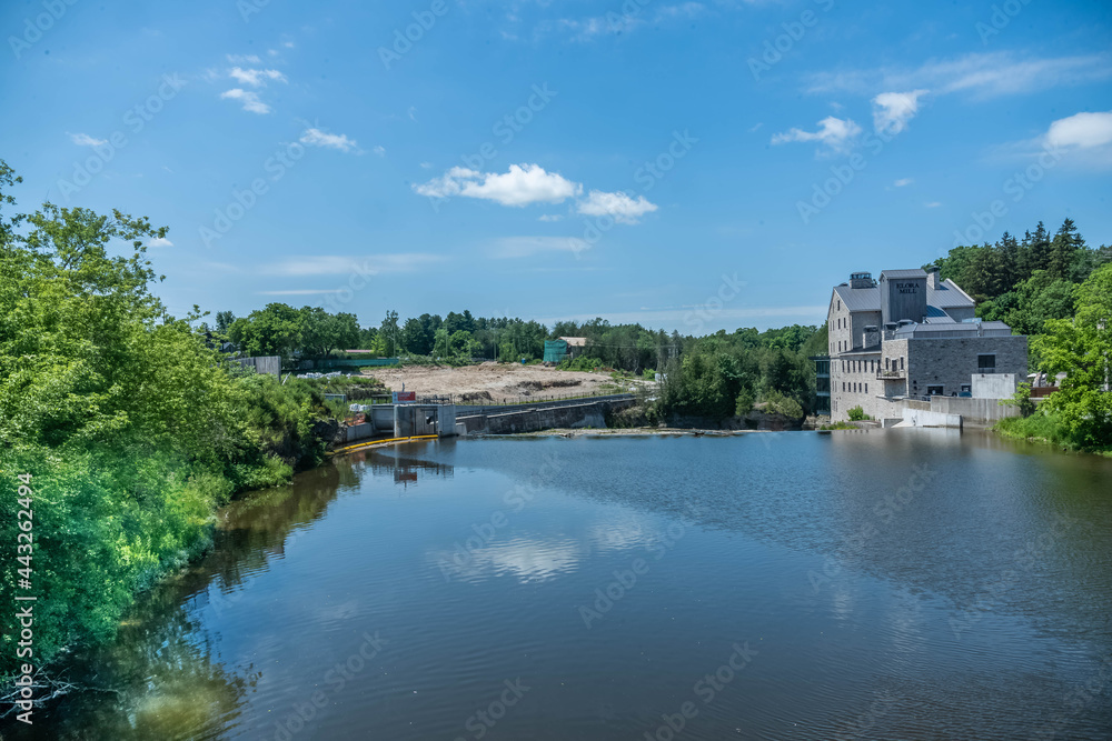 A view of Elora with Elora Mill and restaurant with the Grand River.