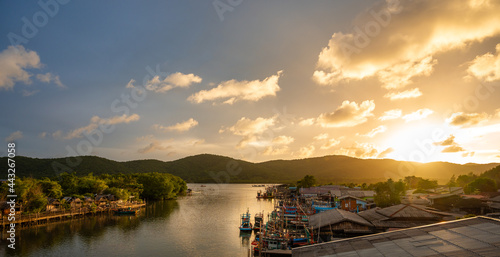 Fisherman Boat with sunset sky in fishing village, Ban Pak Nam Khaem Nu, Chanthaburi, Thailand.