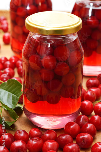 Cherry compote, sour cherries compote, jar of fruit.
