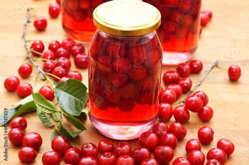 Cherry compote, sour cherries compote, jar of fruit.