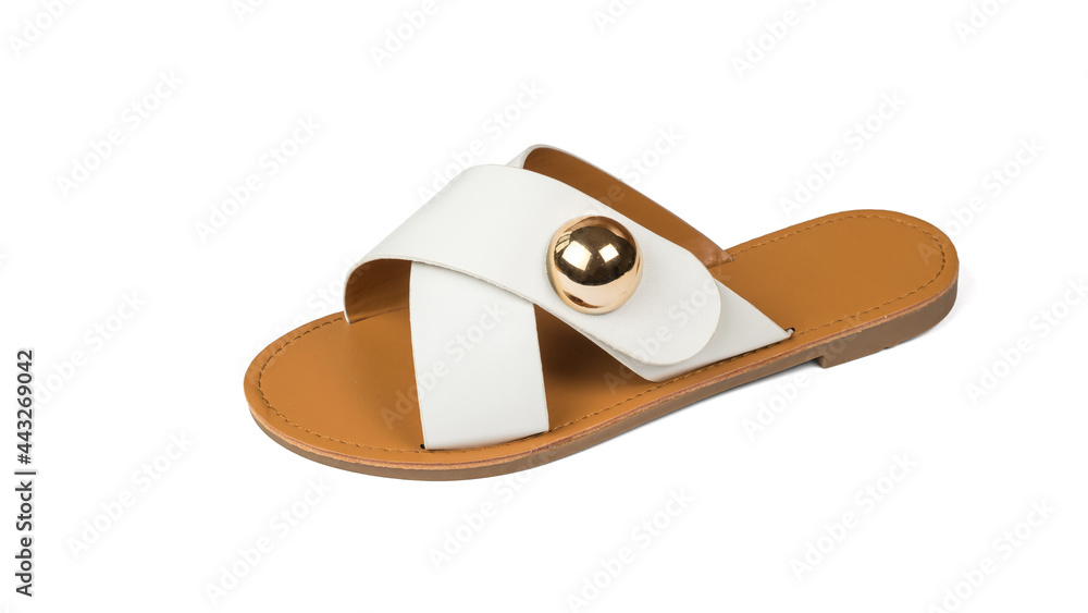 Women's sandal with a metal brooch isolated on a white background.