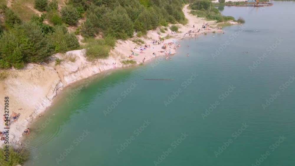 aerial view of sand beach at lake with blue water aerial view of sand beach at lake with blue water