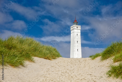 the white square lighthouse of Blavandshuk in denmark photo