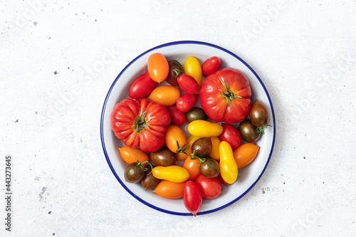 Colored fresh tomatoes in a bowl