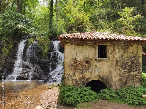 Water mill 'de la Peña' in PR AS 137 trail between Valbucar and BUsllaz villages, also known as 'Molinos del profundu', Villaviciosa, Asturias, Spain photo