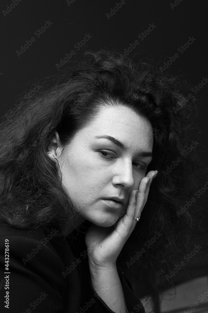Emotional portraits of a beautiful and curly girl in a jacket Emotional portraits of a beautiful and curly girl in a jacket