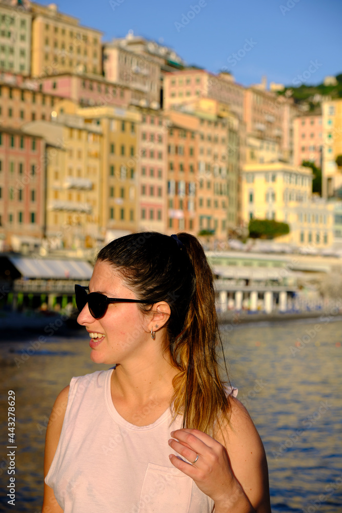 young model wearing sunglasses in the coast of camogli