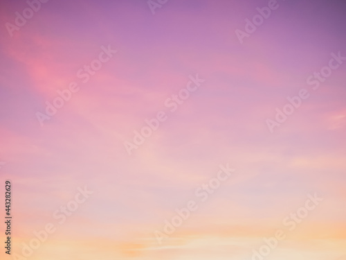Majestic dusk. Twilight in the evening with gentle sunlight. Pastel colours. Abstract nature background. Pink, purple, lilac and yellow colors of clouds in sunset sky