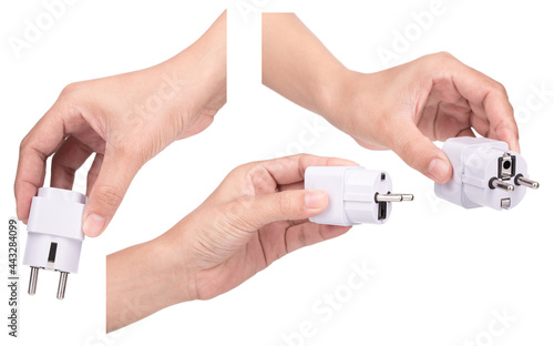 Collection of hand holding Universal US EU AU UK Plug Adapter Converter AC Travel Power Electrical Socket Outlets isolated on white background.