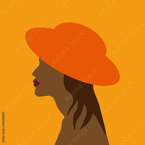 A beautiful tanned girl with long hair  in an orange hat