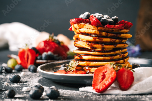 Pancake. Tasty pancakes with fruits, strawberries, berries, sugar. Pancakes with chocolate. Dessert. Breakfast pancakes. 