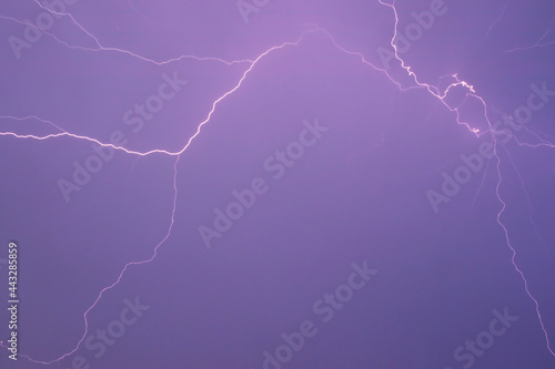 Lightning bolt, purple sky. Electric discharge in the atmosphere