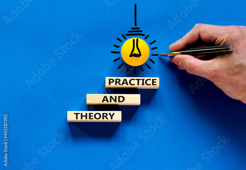 Theory and practice symbol. Wooden blocks with words 'Theory and practice' on a beautiful blue background. Businessman hand, light bulb icon. Business, theory and practice concept. Copy space.