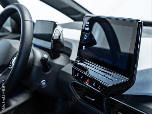 Modern electric car interior and dashboard with monitors and multimedia systems