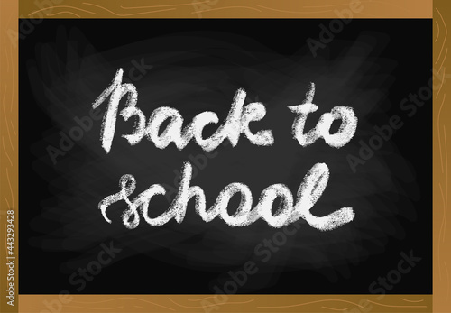 School table blackboard in wood frame with chalk texture text back to school