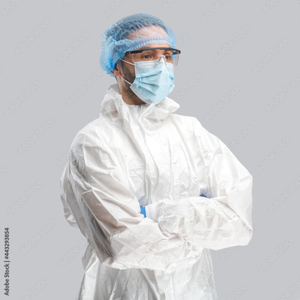 A man in a protective antibacterial suit. The concept of anti-epidemic measures. A warning sign. AntiCOVID. Vaccine against coronavirus A man in a protective antibacterial suit. The concept of anti-epidemic measures. A warning sign. AntiCOVID. Vaccine against coronavirus