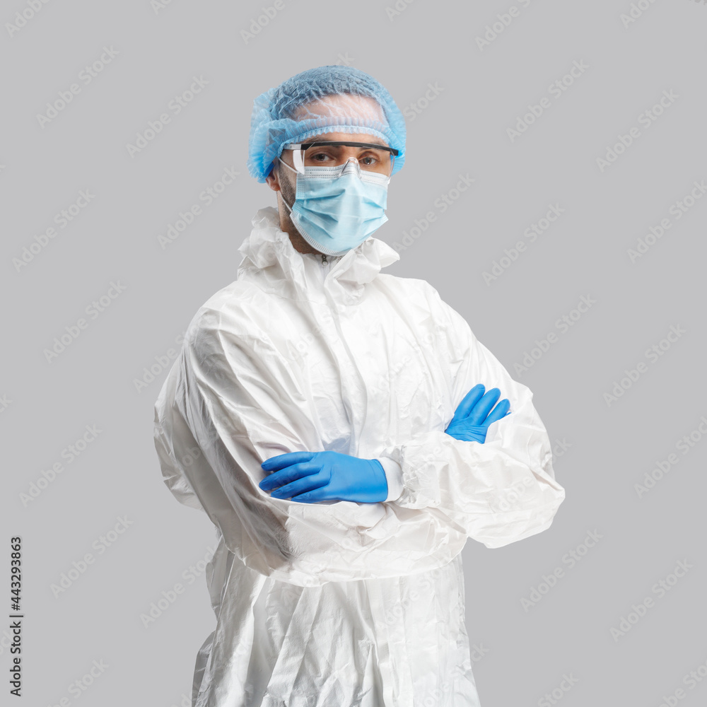 A man in a protective antibacterial suit. The concept of anti-epidemic measures. A warning sign. AntiCOVID. Vaccine against coronavirus A man in a protective antibacterial suit. The concept of anti-epidemic measures. A warning sign. AntiCOVID. Vaccine against coronavirus