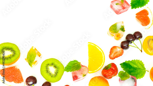 Fototapeta Naklejka Na Ścianę i Meble -  Mix of fresh juicy fruits, berries and ice on a white background. Image with selective focus