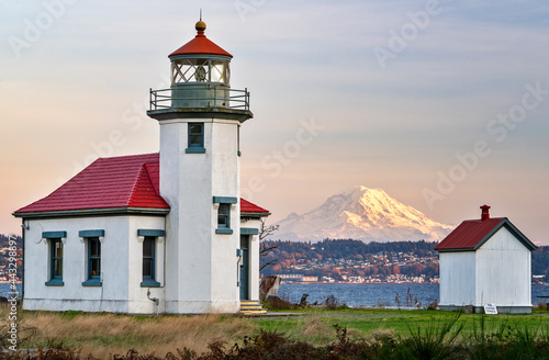 The Beautiful Point Robinson Lighthouse with Mount Rainier in the Backdrop during Sunset photo