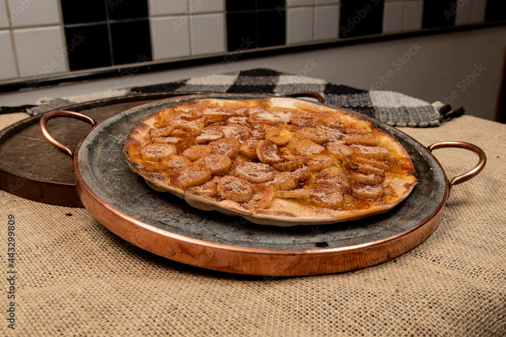 Sweet Brazilian pizza with banana, cinnamon and sugar