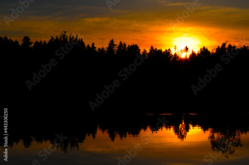 Sunset and its reflection © Denny
