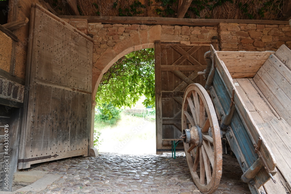 Farm gate and old wooden cart