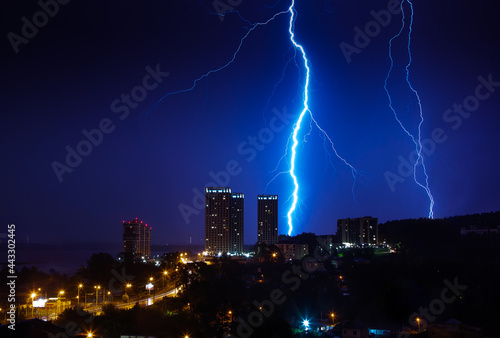 Thunderstorm over the city in blue light. Lightning in the night city, Russia, Yekaterinburg.