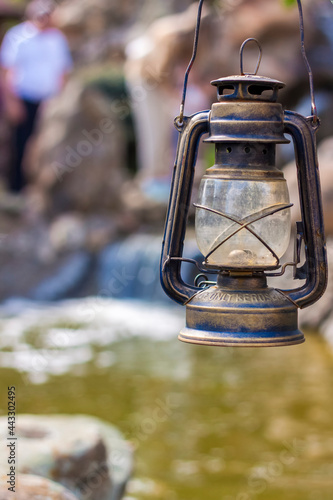 Vintage lamp on the background of a pond photo