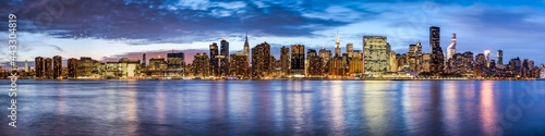 Manhattan skyline panorama at night, New York City, USA photo