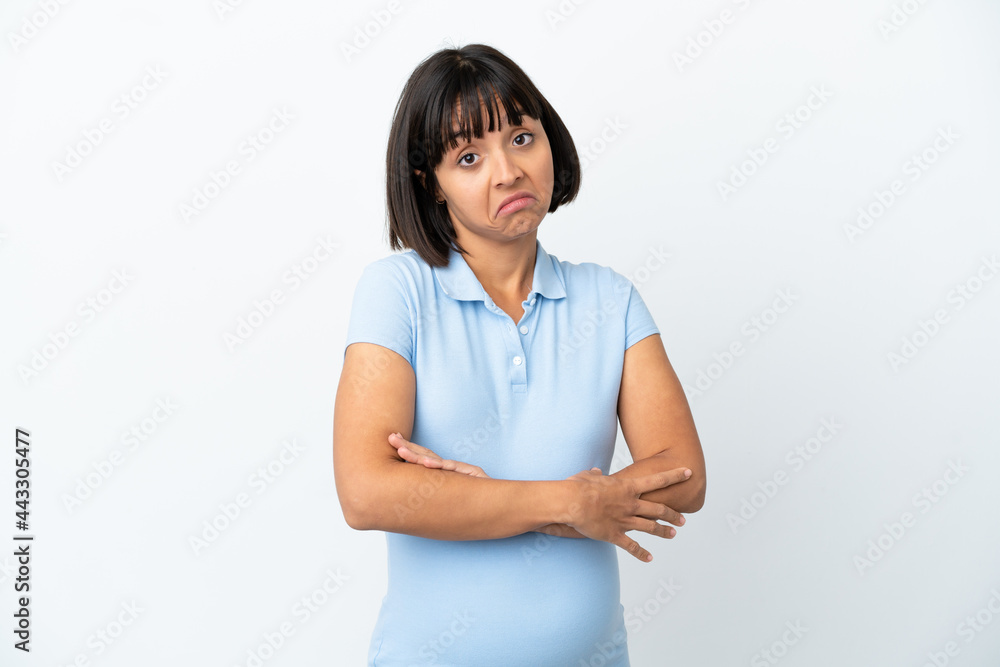 Pregnant woman over isolated white background making doubts gesture while lifting the shoulders Pregnant woman over isolated white background making doubts gesture while lifting the shoulders