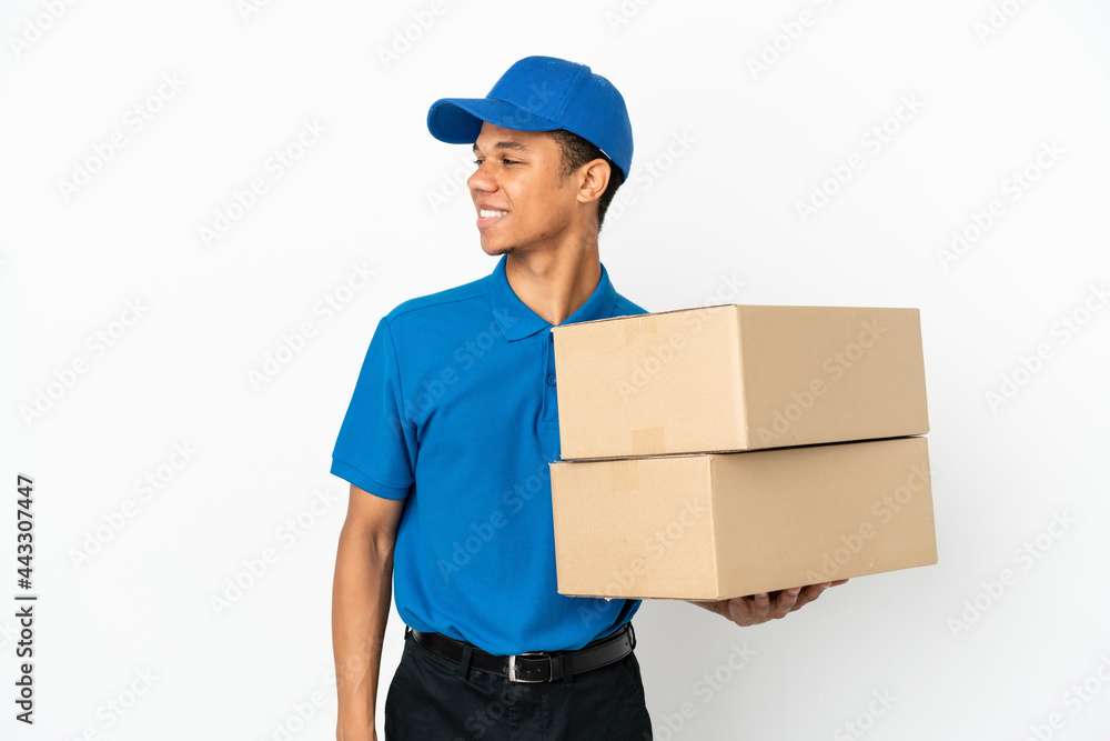 Delivery African American man isolated on white background looking side Delivery African American man isolated on white background looking side