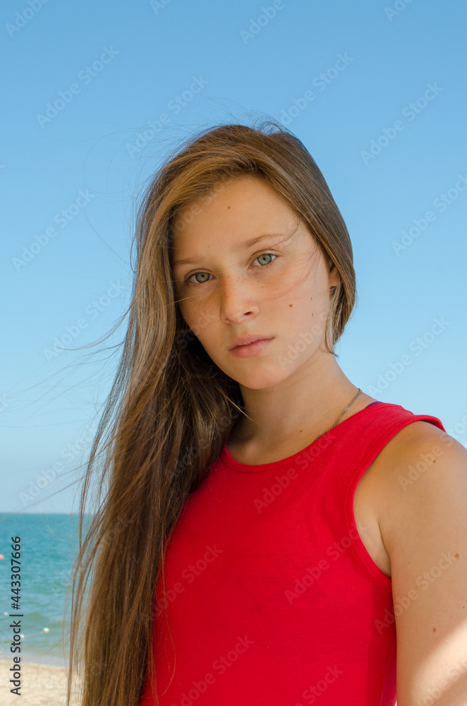 Girl in red at the sea. Girl in red at the sea.