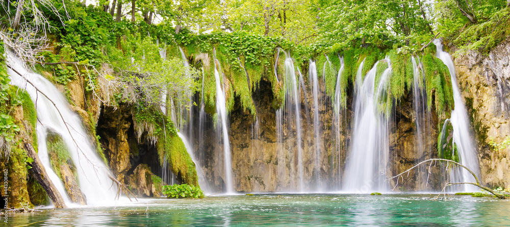 Waterfall in Plitvice Lakes national Park at summer, Croatia. Waterfalls formed by mountain lakes due to melting glaciers