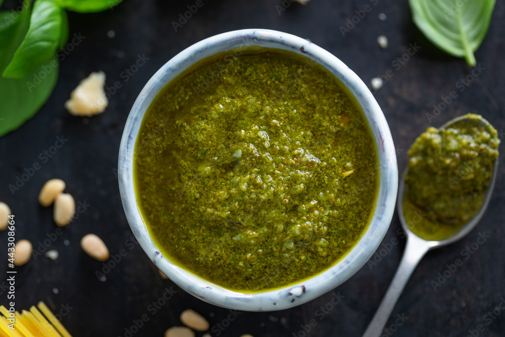 Pesto sauce in small bowl on table Pesto sauce in small bowl on table