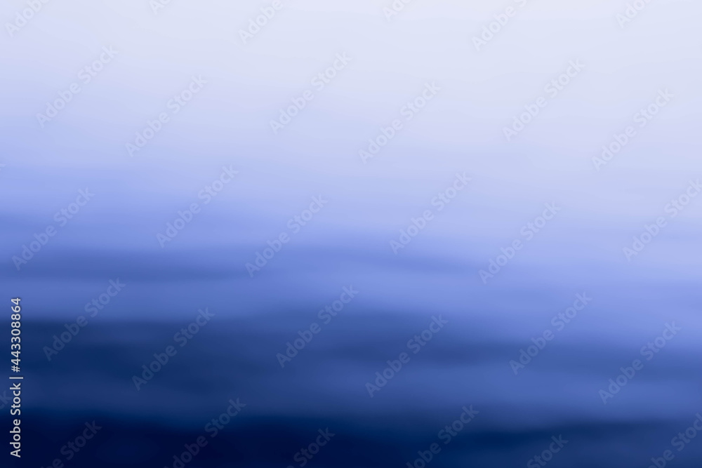 Abstract shot of blurred sea water surface with skyline. Background Abstract shot of blurred sea water surface with skyline. Background