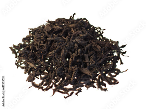 Dry black tea leaves isolated on white background