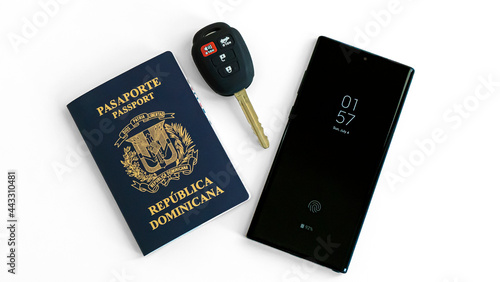 Dominican Republic Passport, car keys and smartphone