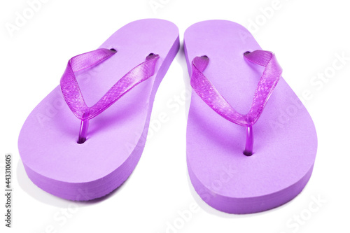 purple rubber beach flip flops on a white background, isolate