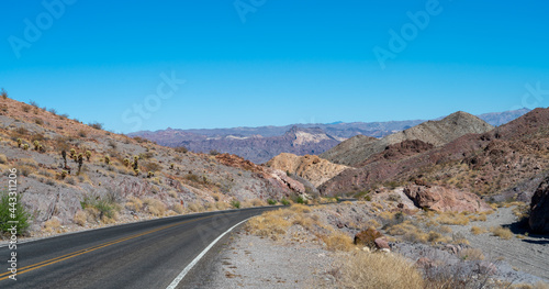 Canvas Print View of Single Two Way Road Through the NEvada Mountains With Clear Skies