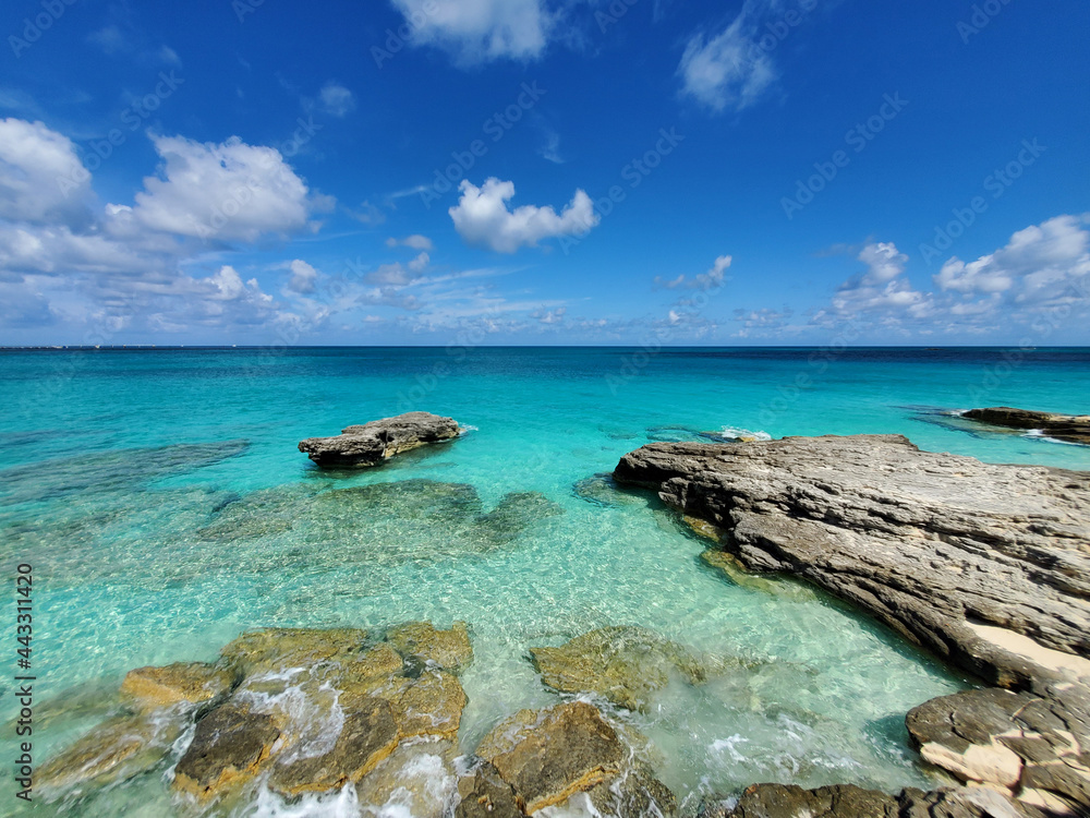 Crystal clear water amidst rocks and sandy beaches of North Bimini's west coast in Bahamas. Crystal clear water amidst rocks and sandy beaches of North Bimini's west coast in Bahamas.