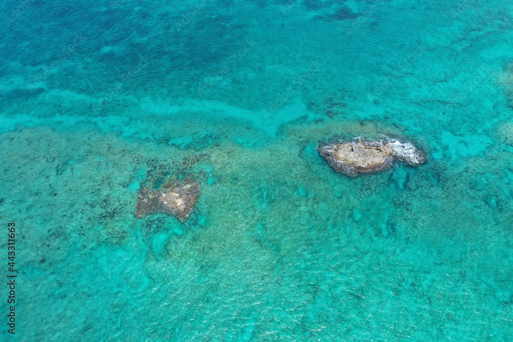 Aerial view of coral rocks off North Bimini, Bahamas on sunny summer afternoon. Aerial view of coral rocks off North Bimini, Bahamas on sunny summer afternoon.
