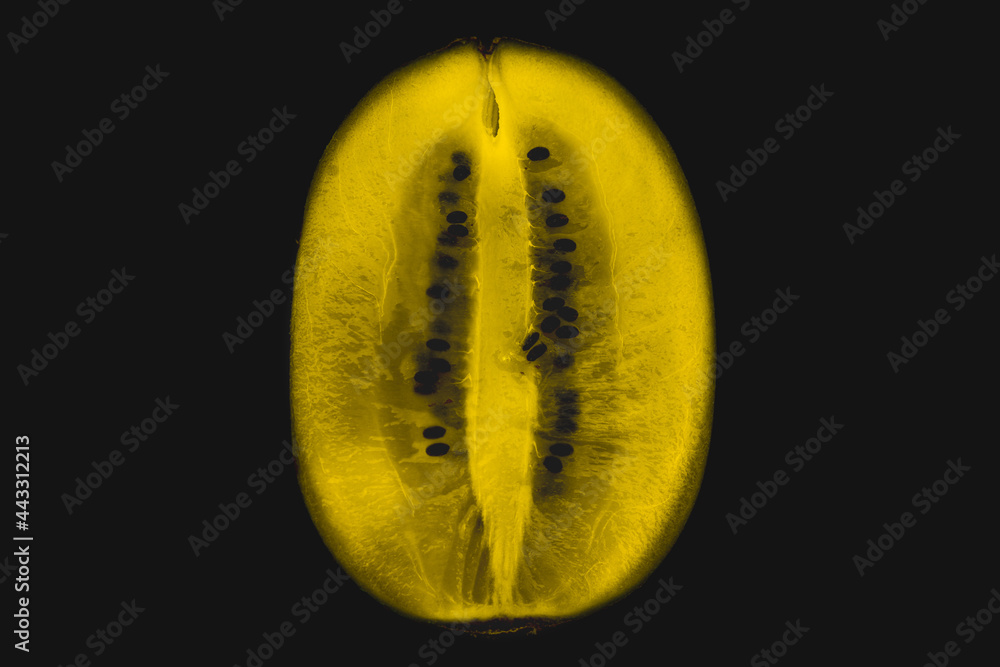 kiwi fruit cut in half, still life, studio photography, fruit on a black background kiwi fruit cut in half, still life, studio photography, fruit on a black background